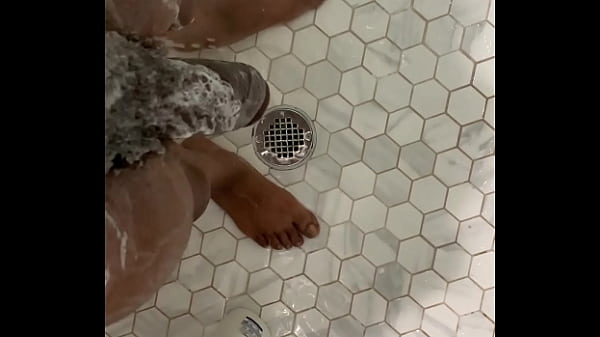 Stepsister joins stepbrother in shower and gives him a hand